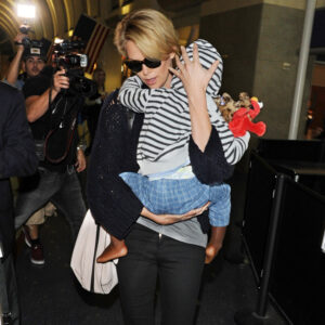 Charlize Theron holds son Jackson tight at LAX